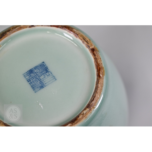 311 - An 18th century Chinese celadon jar and cover, Yueyaer guan (月牙耳罐) with gilt metal mounts, the taper... 