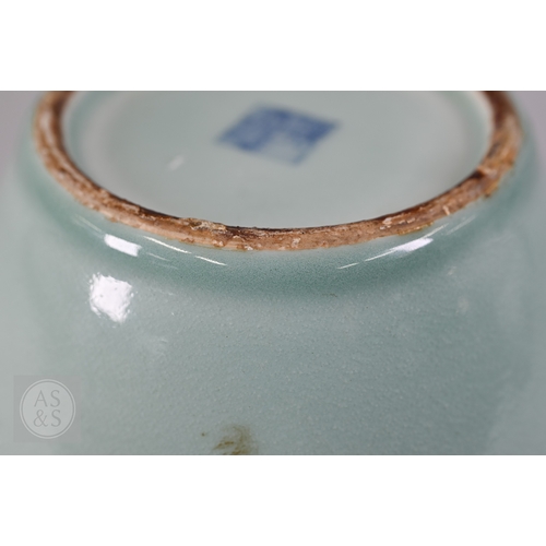 311 - An 18th century Chinese celadon jar and cover, Yueyaer guan (月牙耳罐) with gilt metal mounts, the taper... 