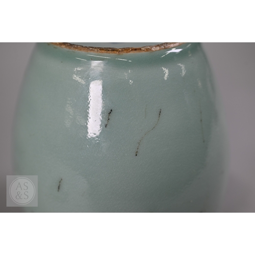 311 - An 18th century Chinese celadon jar and cover, Yueyaer guan (月牙耳罐) with gilt metal mounts, the taper... 