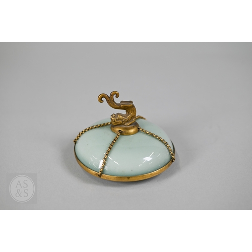 311 - An 18th century Chinese celadon jar and cover, Yueyaer guan (月牙耳罐) with gilt metal mounts, the taper... 