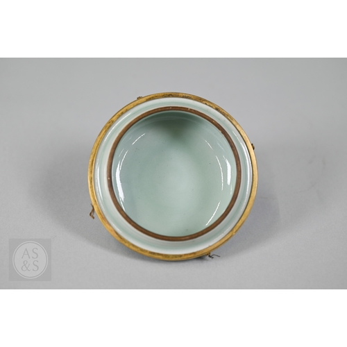 311 - An 18th century Chinese celadon jar and cover, Yueyaer guan (月牙耳罐) with gilt metal mounts, the taper... 