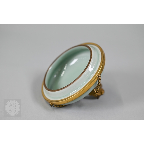 311 - An 18th century Chinese celadon jar and cover, Yueyaer guan (月牙耳罐) with gilt metal mounts, the taper... 