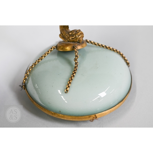 311 - An 18th century Chinese celadon jar and cover, Yueyaer guan (月牙耳罐) with gilt metal mounts, the taper... 