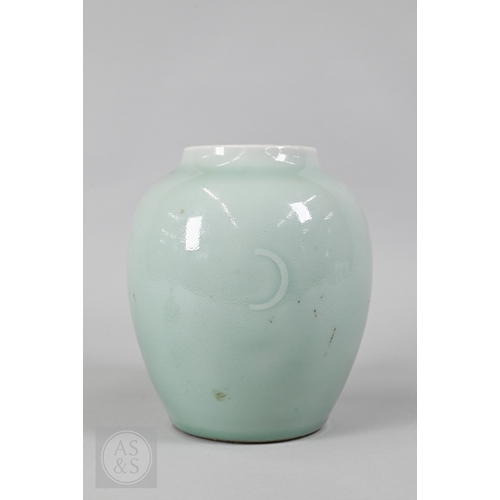 311 - An 18th century Chinese celadon jar and cover, Yueyaer guan (月牙耳罐) with gilt metal mounts, the taper... 