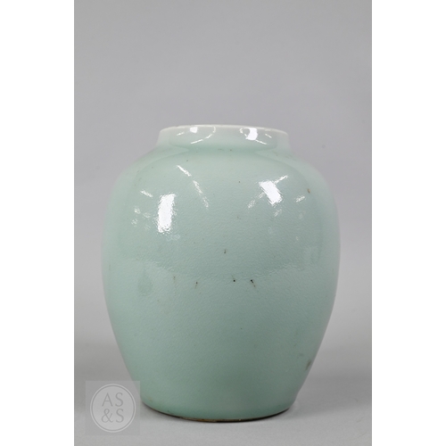 311 - An 18th century Chinese celadon jar and cover, Yueyaer guan (月牙耳罐) with gilt metal mounts, the taper... 