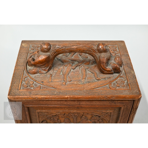 312 - An early-mid 20th century Chinese Mah Jong set, the wooden case decoratively carved with landscapes ... 