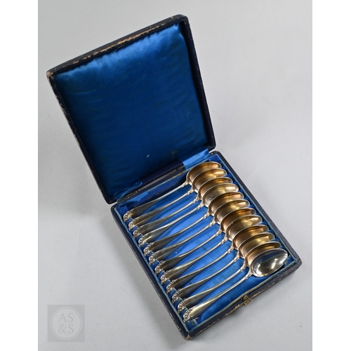 43 - A cased set of twelve French .950 grade silver teaspoons with gilt bowls and chased decoration, Alph... 