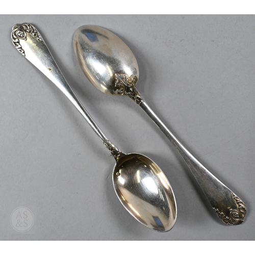 43 - A cased set of twelve French .950 grade silver teaspoons with gilt bowls and chased decoration, Alph... 