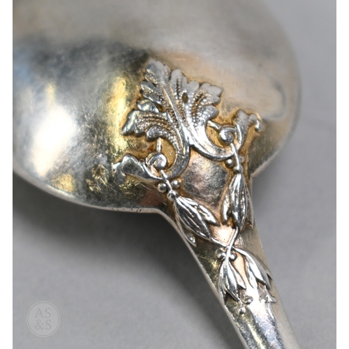43 - A cased set of twelve French .950 grade silver teaspoons with gilt bowls and chased decoration, Alph... 