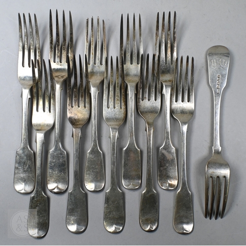 72 - A matched set of Georgian and later fiddle pattern flatware, comprising twelve each table forks and ... 