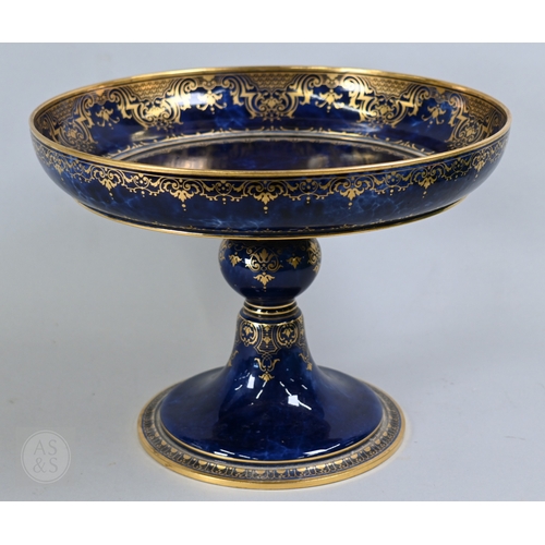 496 - A large Sèvres porcelain comport with revolving bowl top, decorated with gilding on a marbled blue g... 