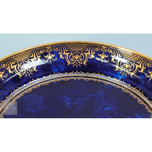 496 - A large Sèvres porcelain comport with revolving bowl top, decorated with gilding on a marbled blue g... 
