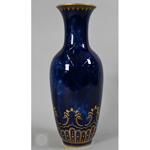 496 - A large Sèvres porcelain comport with revolving bowl top, decorated with gilding on a marbled blue g... 