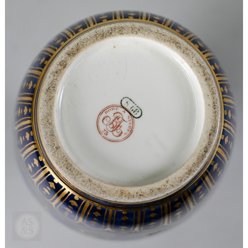 496 - A large Sèvres porcelain comport with revolving bowl top, decorated with gilding on a marbled blue g... 