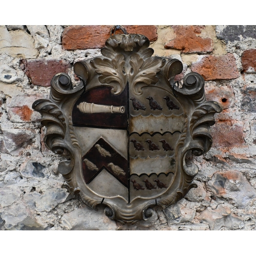 791 - An antique carved stone armorial shield, 43 x 39cm