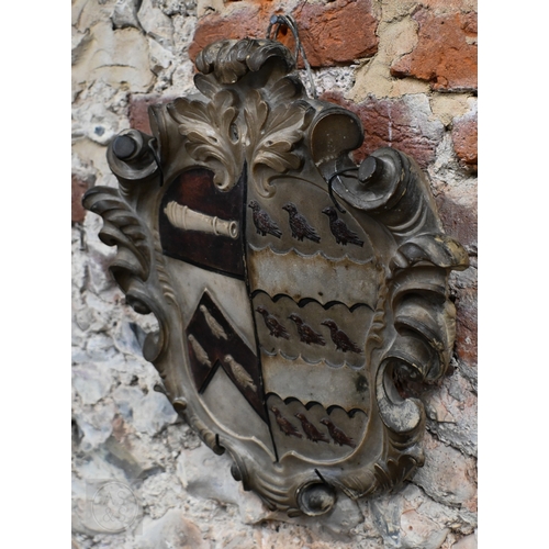 791 - An antique carved stone armorial shield, 43 x 39cm