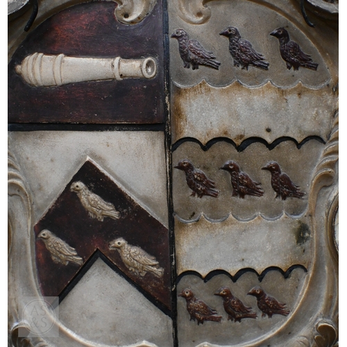 791 - An antique carved stone armorial shield, 43 x 39cm