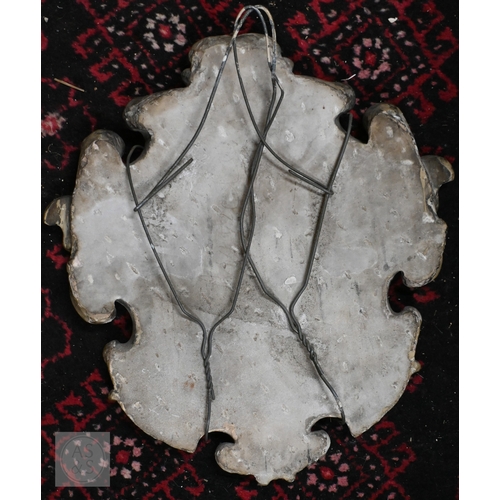 791 - An antique carved stone armorial shield, 43 x 39cm