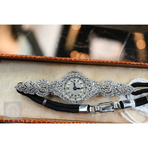 293 - An Art Deco platinum and diamond ladies cocktail watch, the Swiss MGM movement with circular Arabic ... 