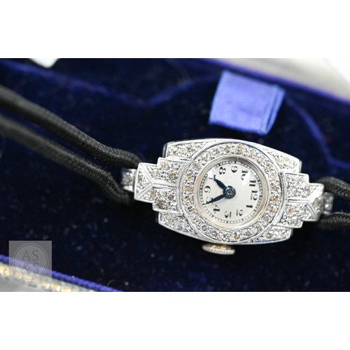 293 - An Art Deco platinum and diamond ladies cocktail watch, the Swiss MGM movement with circular Arabic ... 
