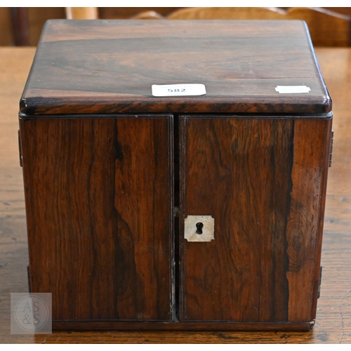 582 - A 19th century rosewood collector's cabinet with twin doors enclosing four drawers with bone handles... 