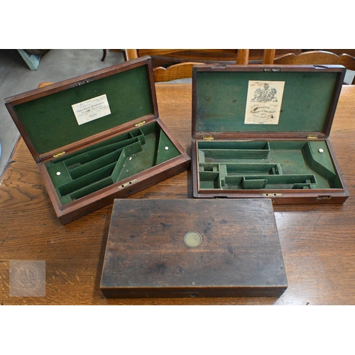 583 - Two 19th century mahogany pistol-cases with fitted baize linings, labels for Wilkinson & Son, Pa... 