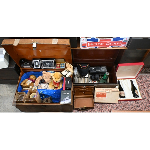 584 - Two tin trunks with contents, including two Spanish silver photograph frames, Pentax Program A SLR c... 