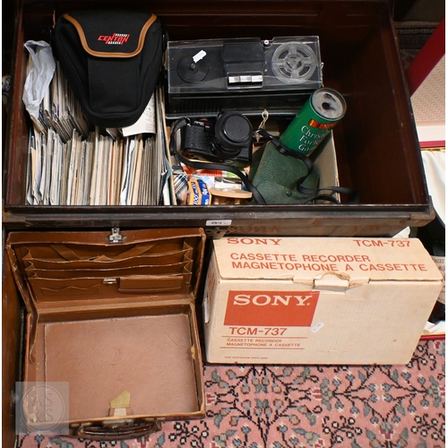 584 - Two tin trunks with contents, including two Spanish silver photograph frames, Pentax Program A SLR c... 