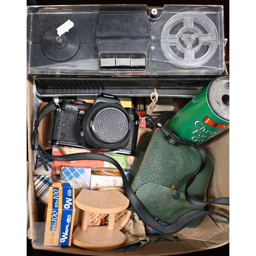 584 - Two tin trunks with contents, including two Spanish silver photograph frames, Pentax Program A SLR c... 