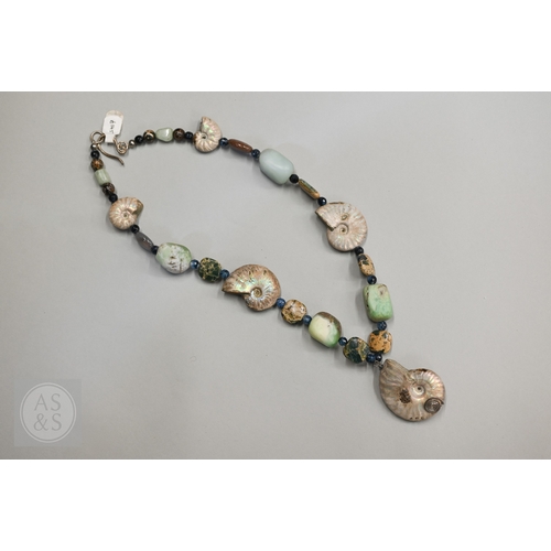470 - A hardstone and iridescent ammonite necklace, a lapis lazuli bead necklace and a green chalcedony st... 