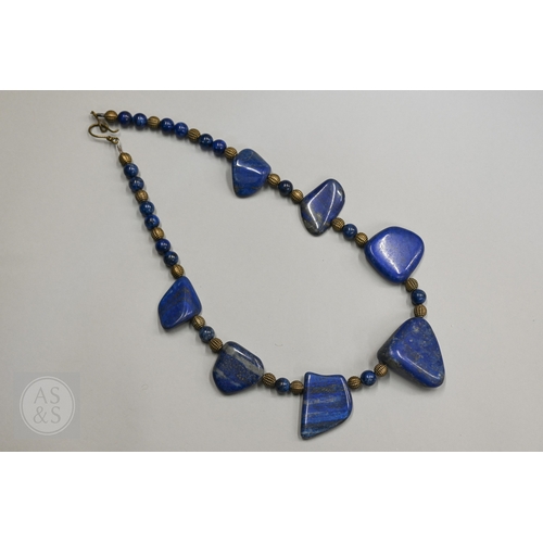 470 - A hardstone and iridescent ammonite necklace, a lapis lazuli bead necklace and a green chalcedony st... 