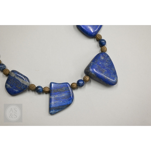 470 - A hardstone and iridescent ammonite necklace, a lapis lazuli bead necklace and a green chalcedony st... 