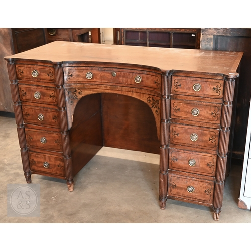182 - A 19th century mahogany and ebony inlaid concave kneehole desk with eleven drawers and segmented ree...