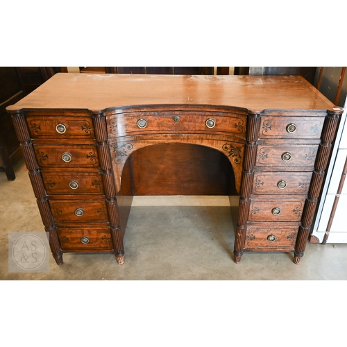 182 - A 19th century mahogany and ebony inlaid concave kneehole desk with eleven drawers and segmented ree... 