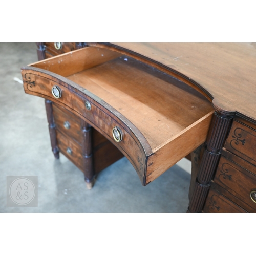 182 - A 19th century mahogany and ebony inlaid concave kneehole desk with eleven drawers and segmented ree... 