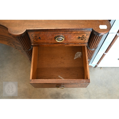 182 - A 19th century mahogany and ebony inlaid concave kneehole desk with eleven drawers and segmented ree... 