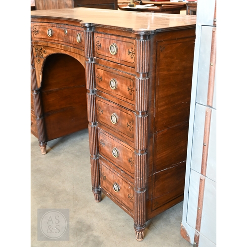 182 - A 19th century mahogany and ebony inlaid concave kneehole desk with eleven drawers and segmented ree... 