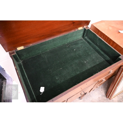 377 - A 19th century mahogany dressing table with hinged top enclosing velvet lined interior over six smal... 