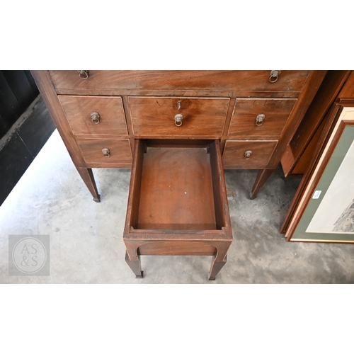 377 - A 19th century mahogany dressing table with hinged top enclosing velvet lined interior over six smal... 