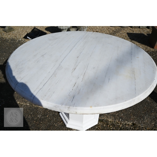 9 - A contemporary circular veined white marble top table raised on a conforming octagonal base, 120 cm ... 