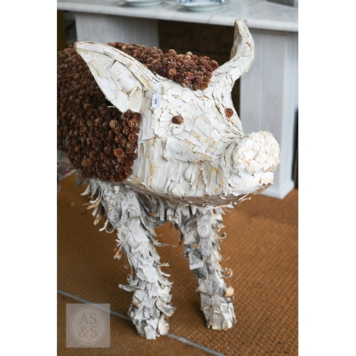 11 - A large artisan made organic pig sculpture, 147 cm long x 90 cm h