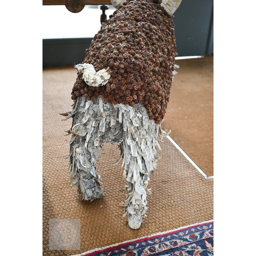 11 - A large artisan made organic pig sculpture, 147 cm long x 90 cm h