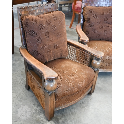 59 - A pair of oak and leather bergere armchairs (2)