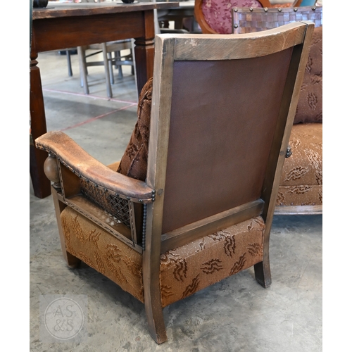 59 - A pair of oak and leather bergere armchairs (2)