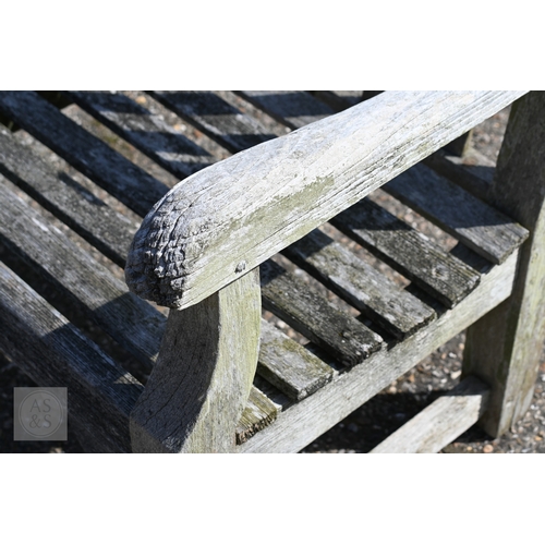 10 - A large weathered teak garden bench, 244 cm long, a/f