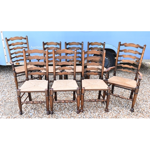 114 - A set of eight ash framed provincial wavy ladderback dining chairs with woven rush seats (6 + 2)