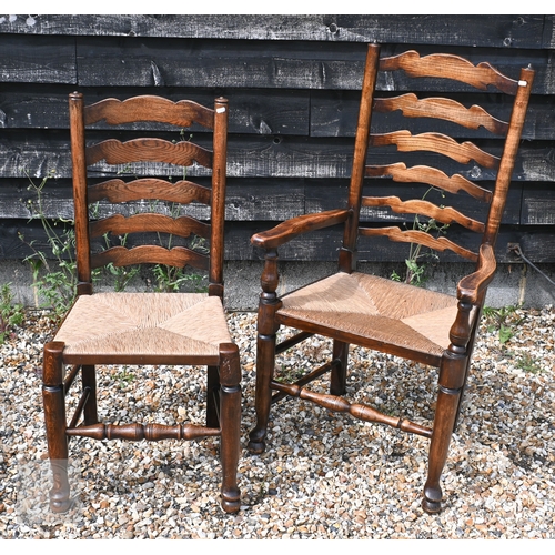 114 - A set of eight ash framed provincial wavy ladderback dining chairs with woven rush seats (6 + 2)