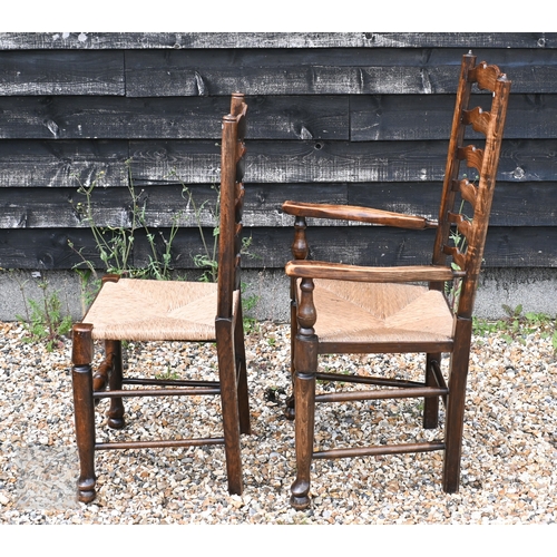 114 - A set of eight ash framed provincial wavy ladderback dining chairs with woven rush seats (6 + 2)