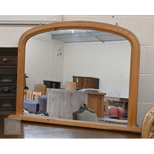 130 - A modern pine framed arched overmantel mirror, 102 cm wide x 74 cm high to/w Victorian mahogany fram... 