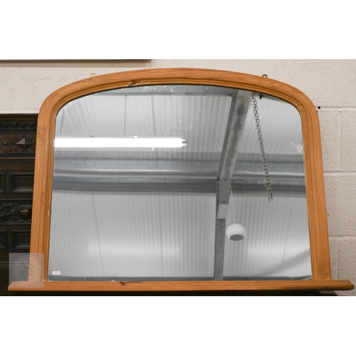 130 - A modern pine framed arched overmantel mirror, 102 cm wide x 74 cm high to/w Victorian mahogany fram... 